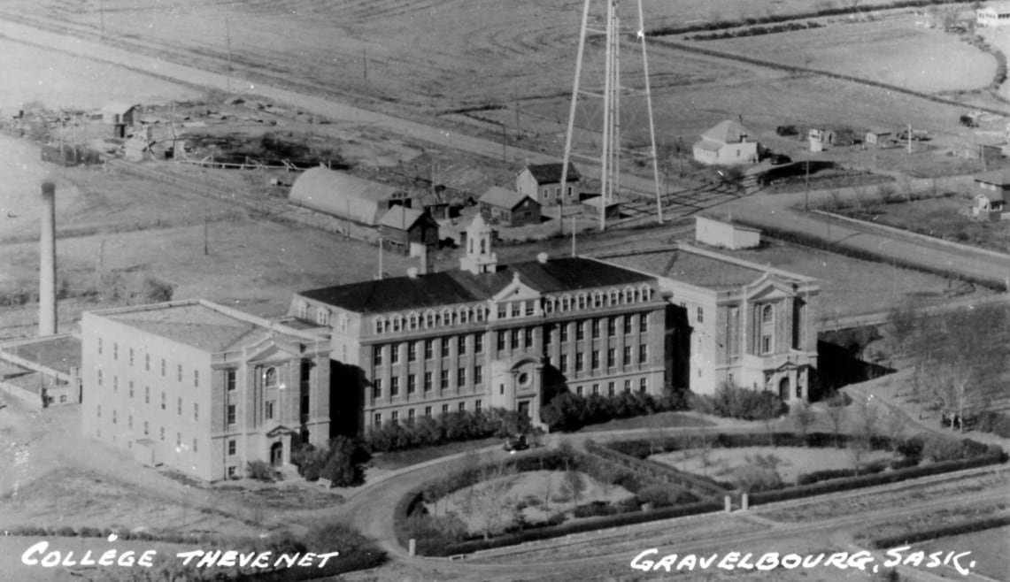 default-654 A black and white photo of a brick building, reading College Thevenet on the bottom left side and Gravelbourg, Sask. on the bottom right side.