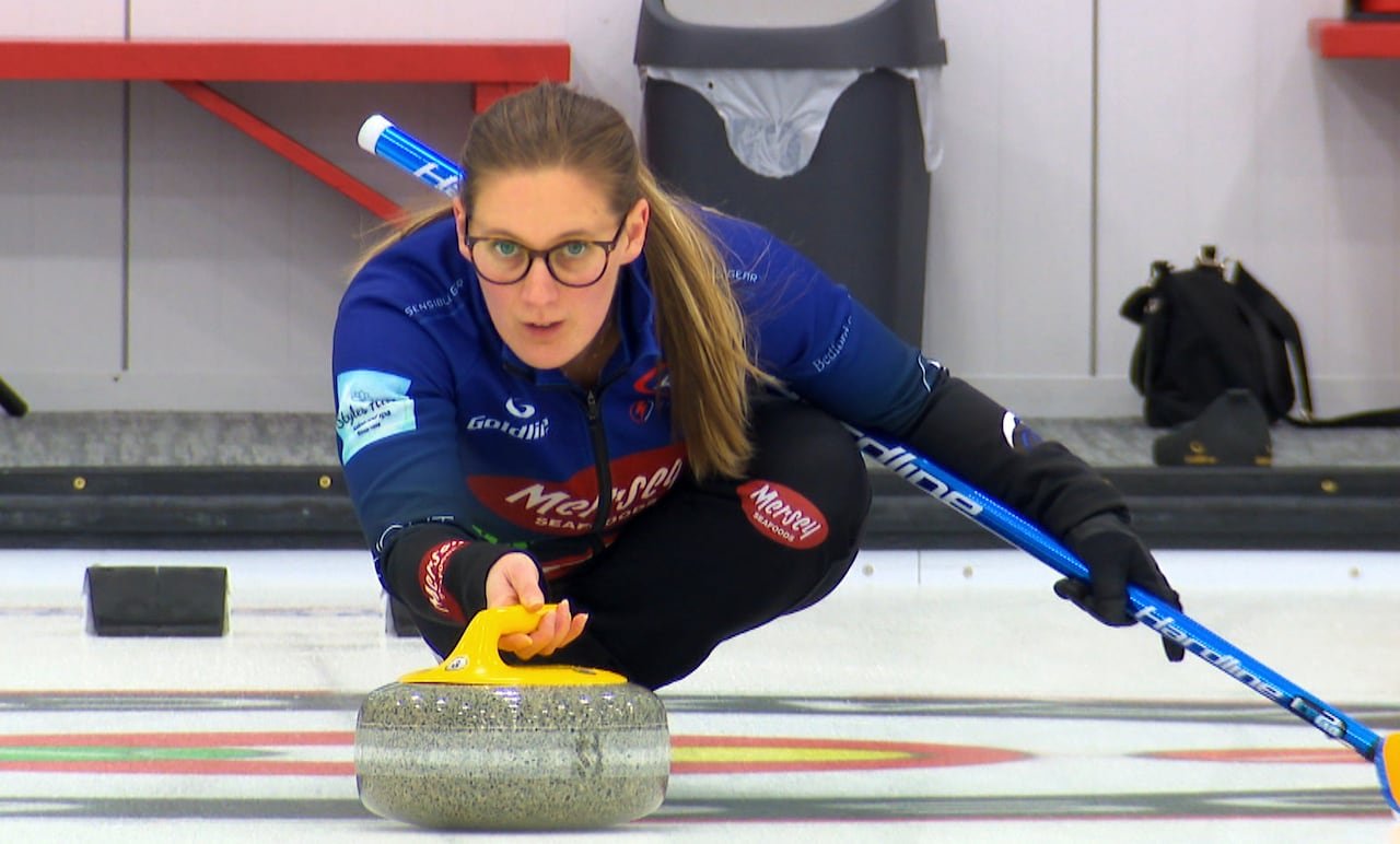default-357 A curler in action on the ice.