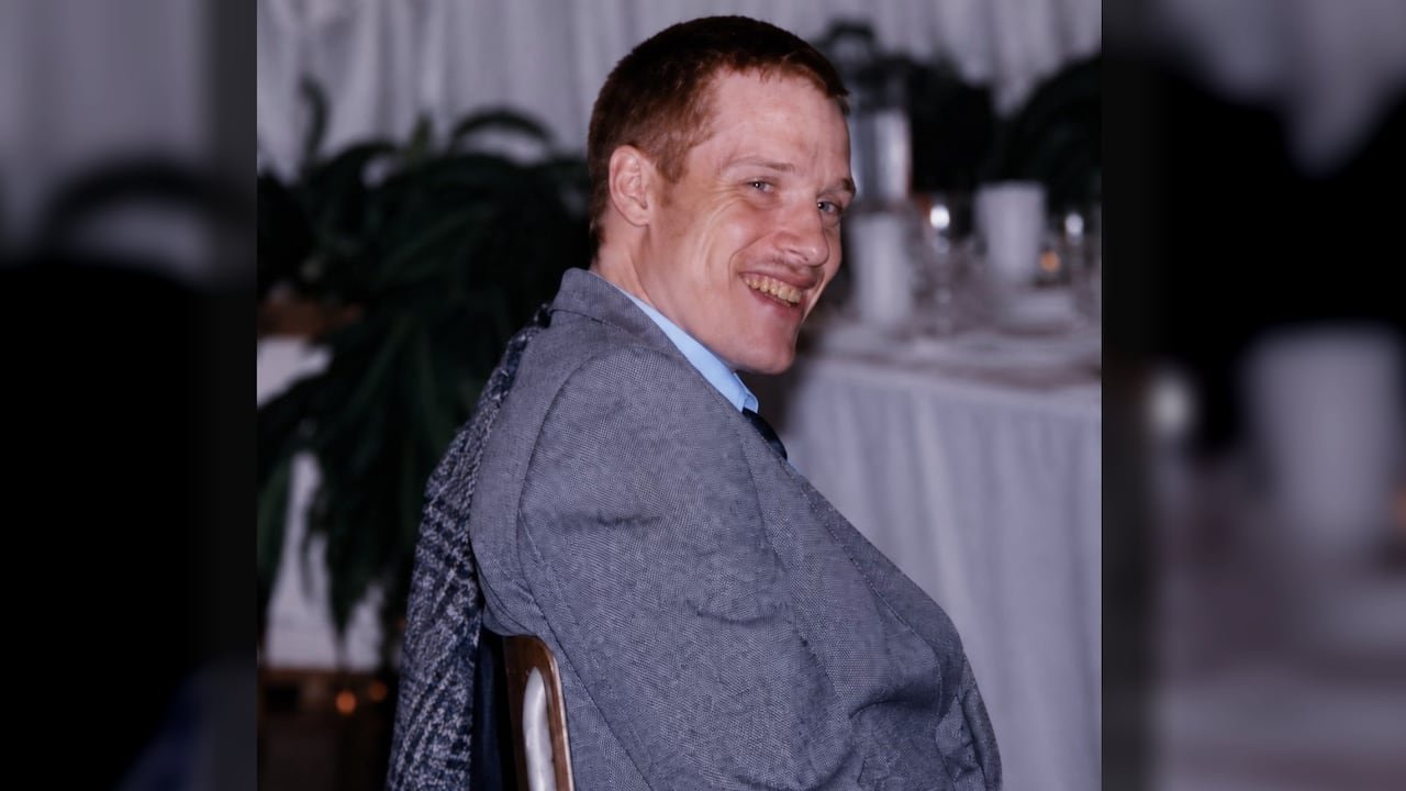 default-643 A man in a suit at a table