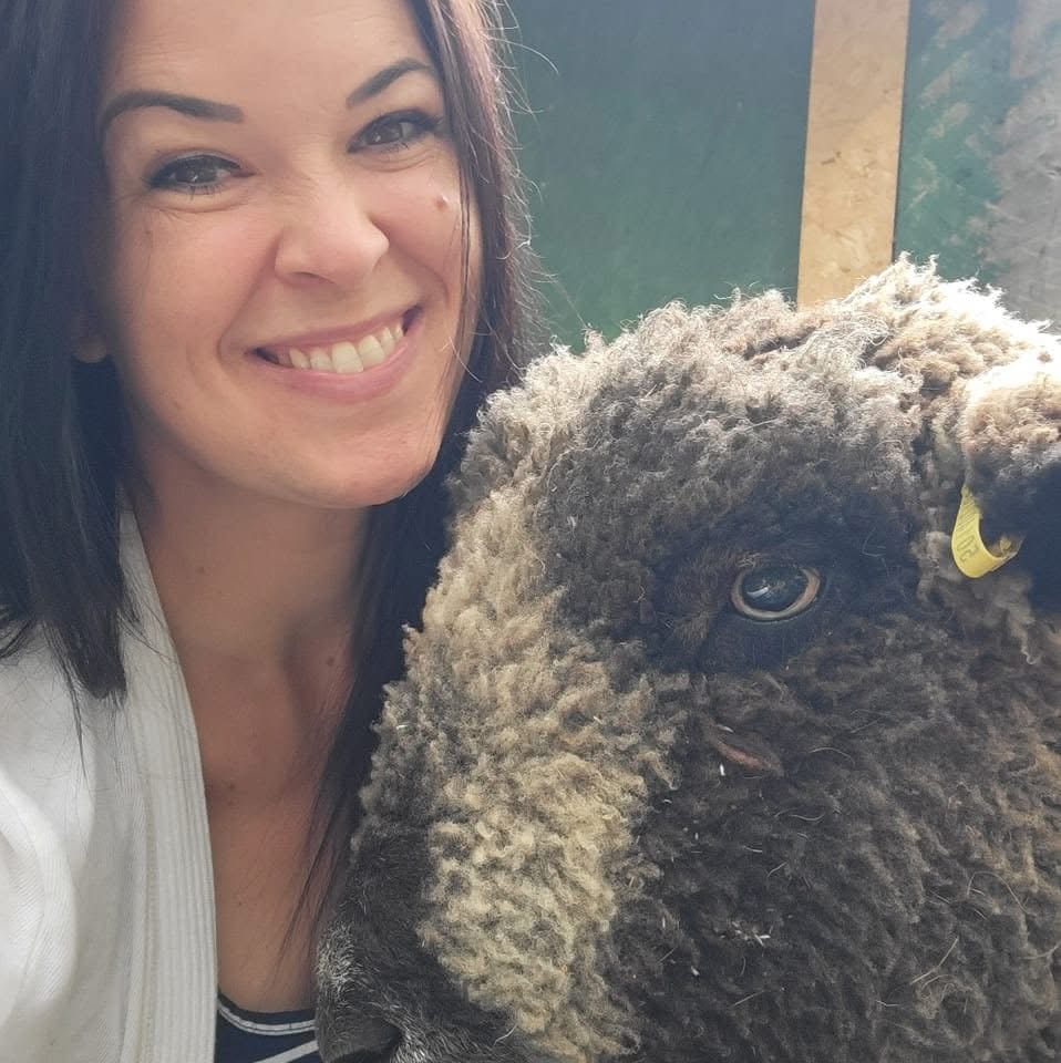 A woman and a sheep.