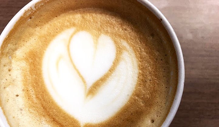 default-461 A cup of latte with a heart designed in the foam.