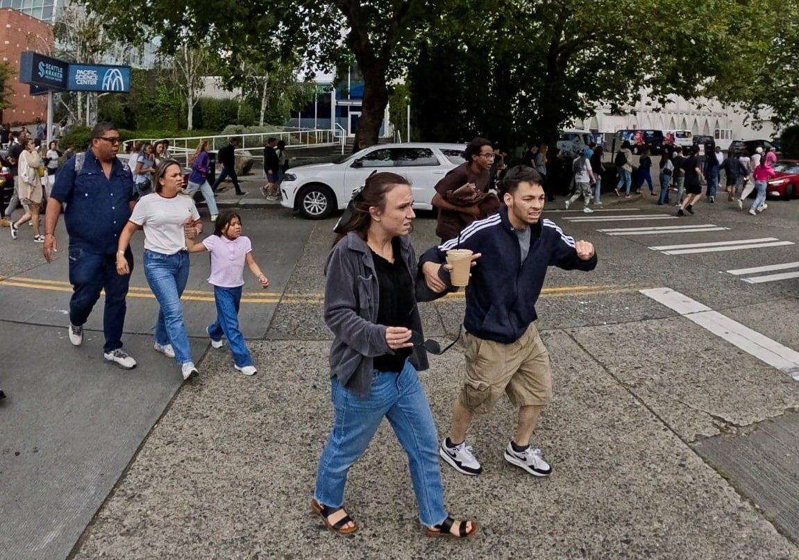default-820 People running away from a shooting incident.